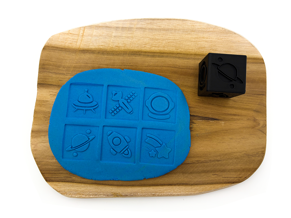 Otiskovací kostka vesmír